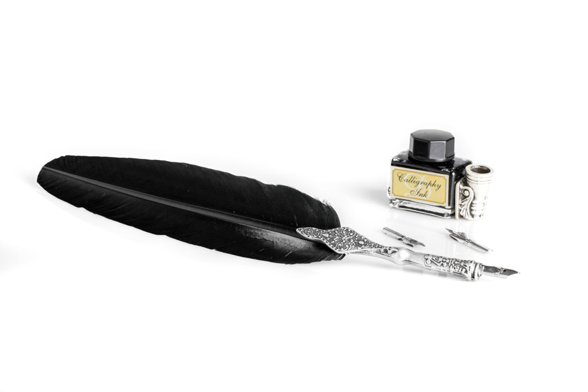 Writing set with decorated black feather pen, calligraphic ink & decorated metal pen holder