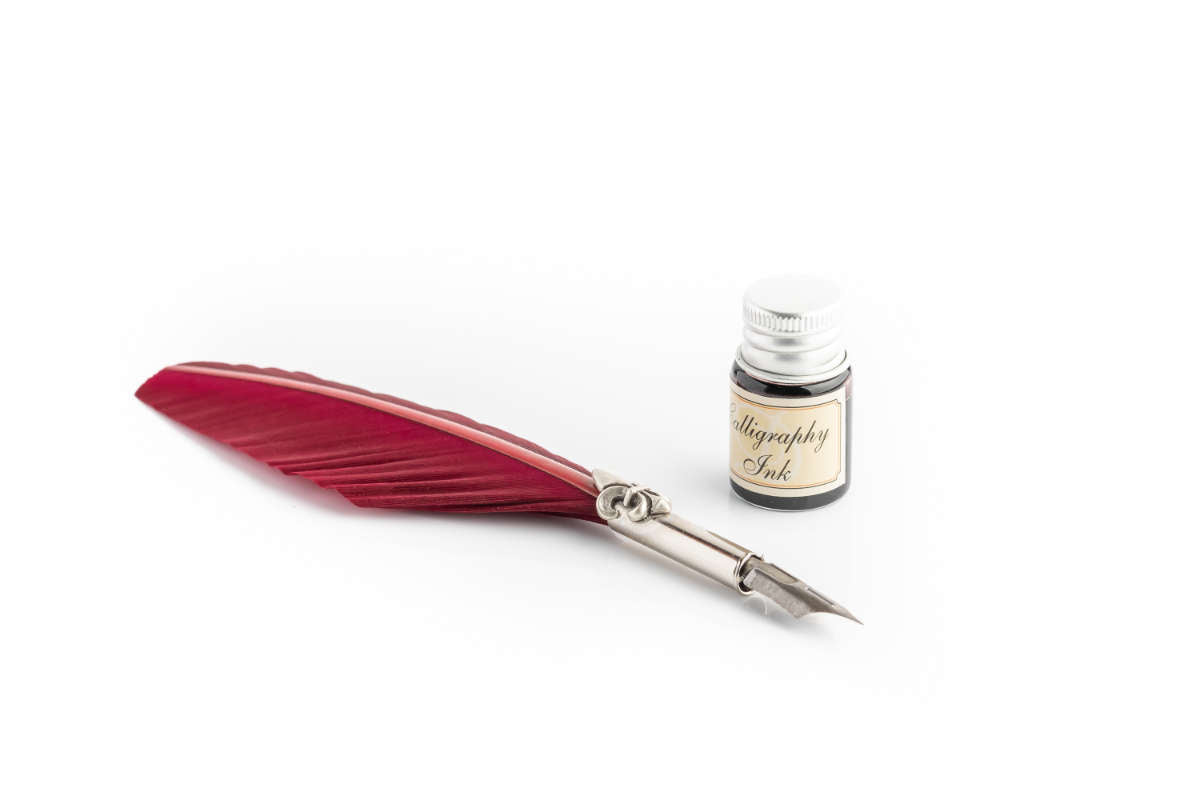 Writing set with burgundy large feather pen, lily decorated ferrule & black ink